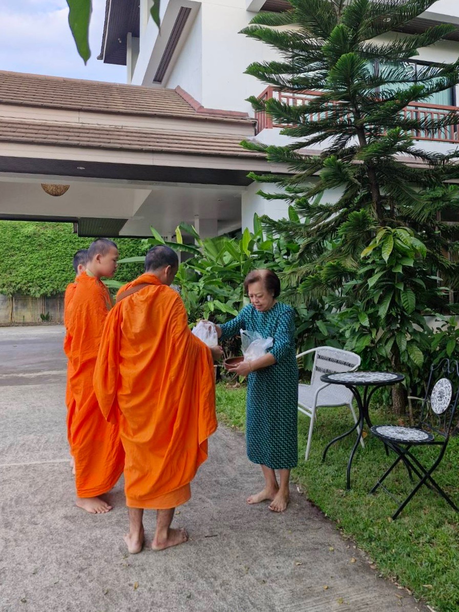 Morning alms giving at Wilacha